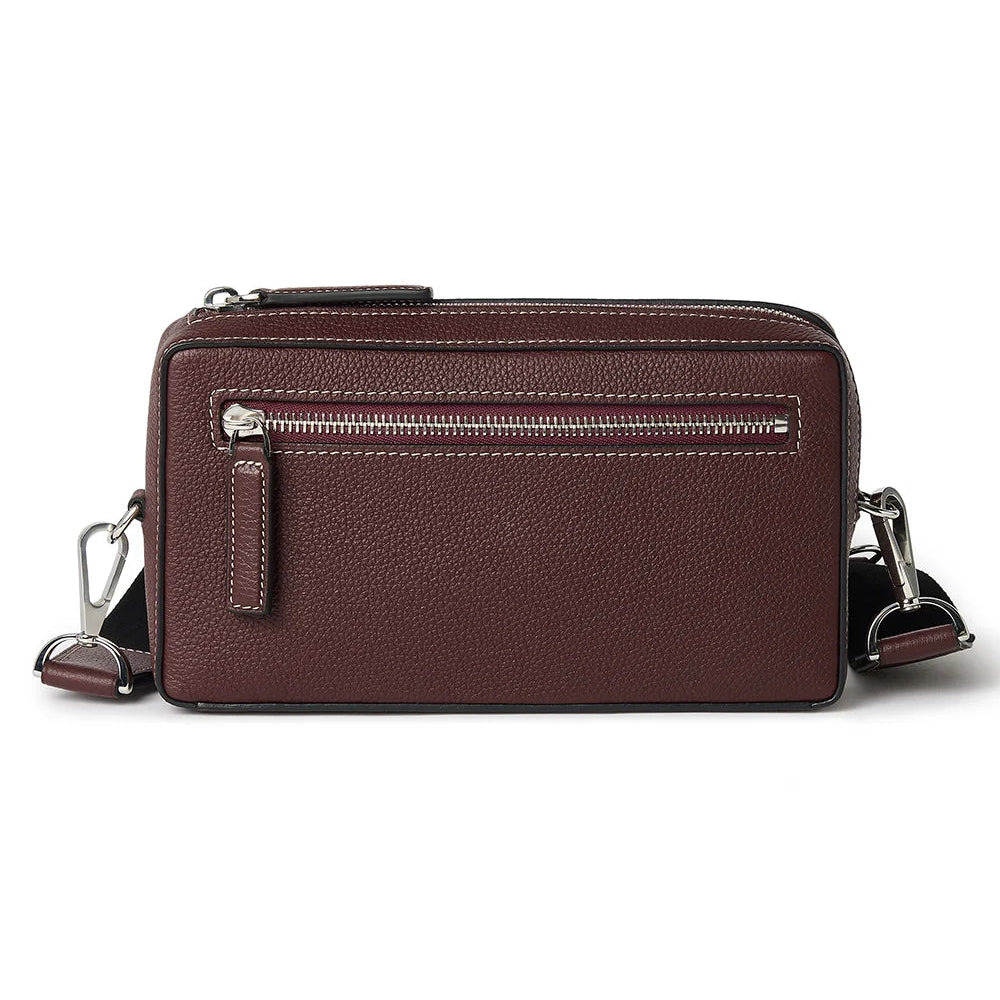 Brown leather crossbody bag on a white background