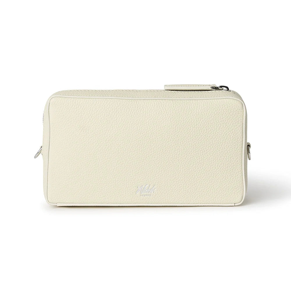 Beige pouch with a Nichols London logo on a white background