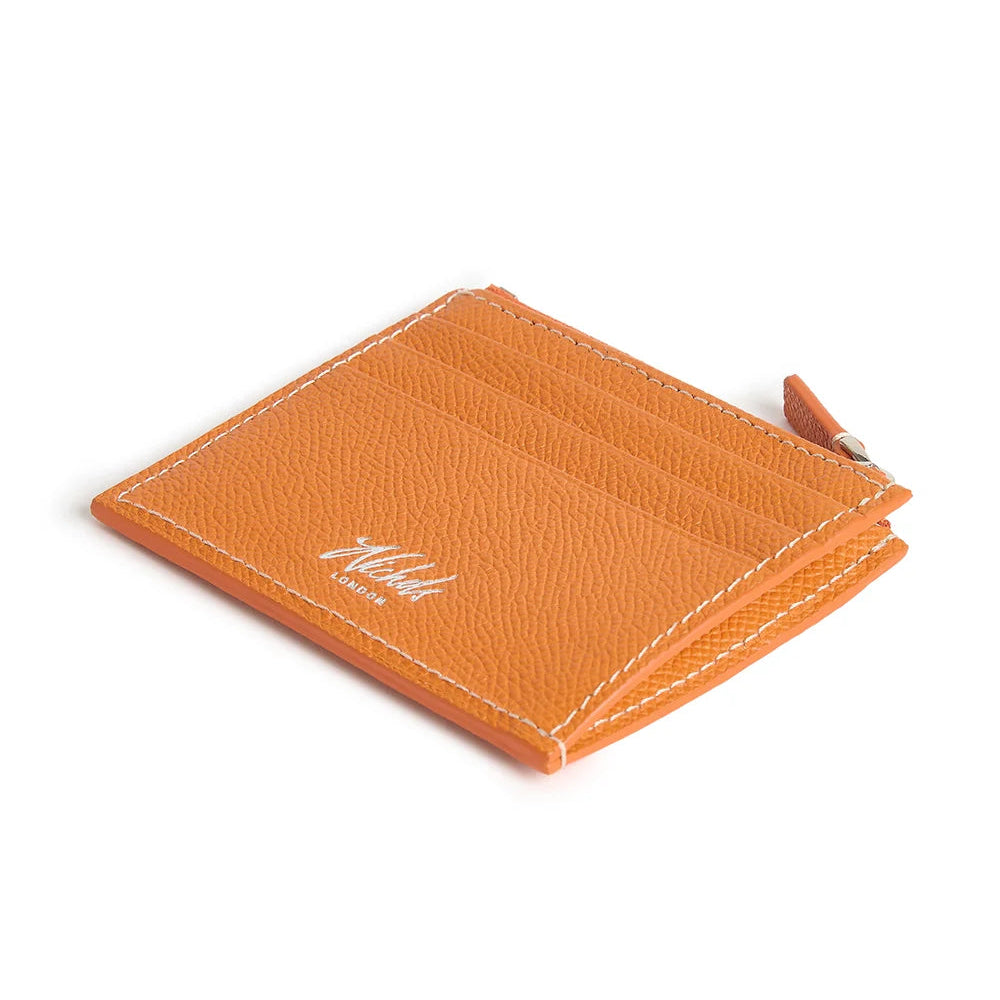 Orange cardholder with Nichols London logo on a white background