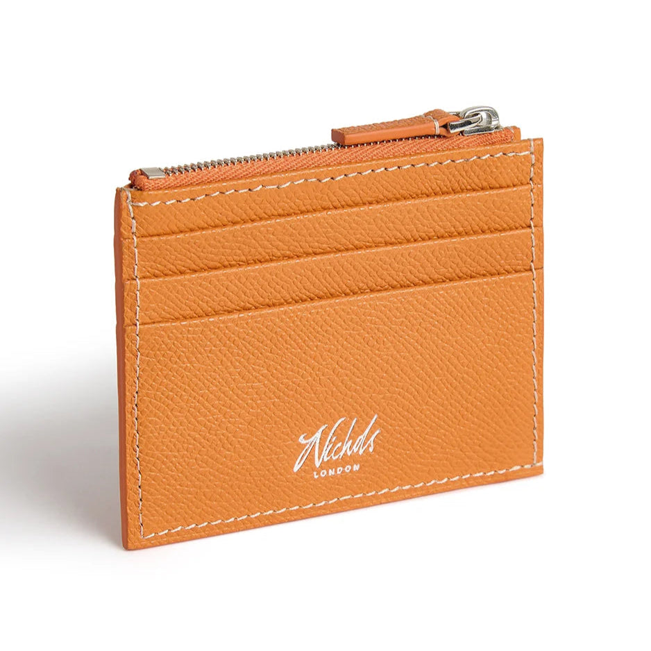 Orange leather cardholder with a Nichols London logo on a white background
