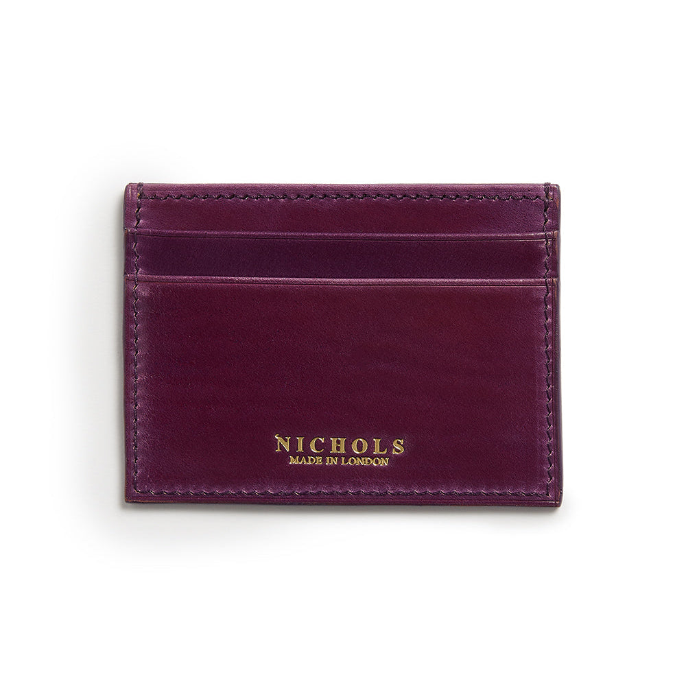 A purple leather card sleeve with the brand name 'NICHOLS' embossed at the bottom.