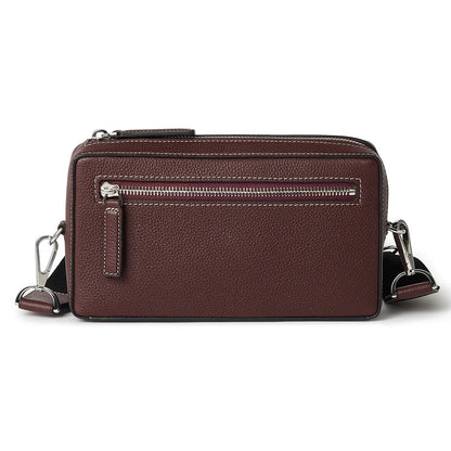Brown leather crossbody bag on a white background