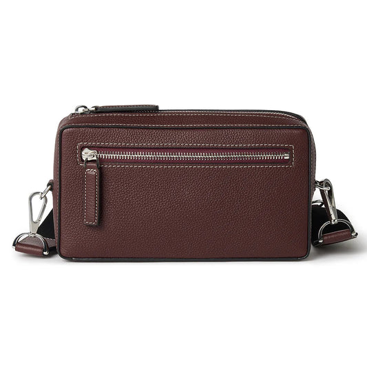Brown leather crossbody bag on a white background