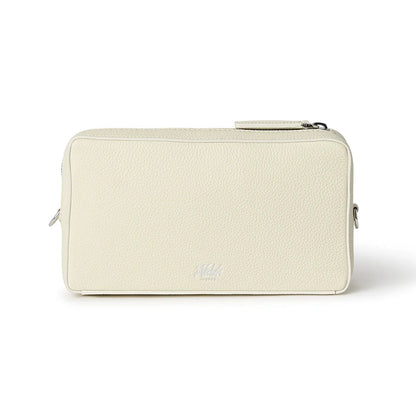 Beige pouch with a Nichols London logo on a white background