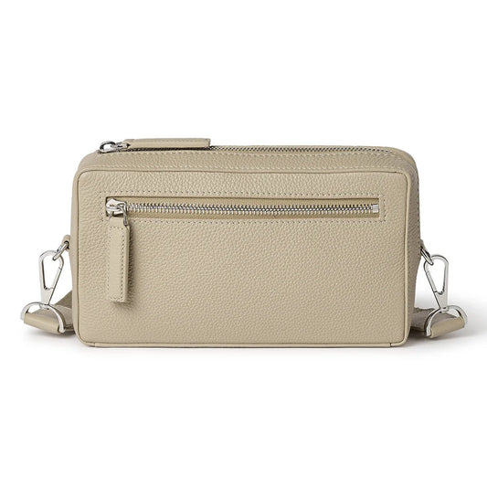 Beige crossbody bag on a white background