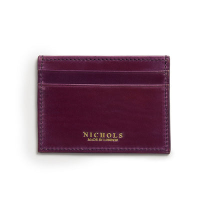 A purple leather card sleeve with the brand name 'NICHOLS' embossed at the bottom.